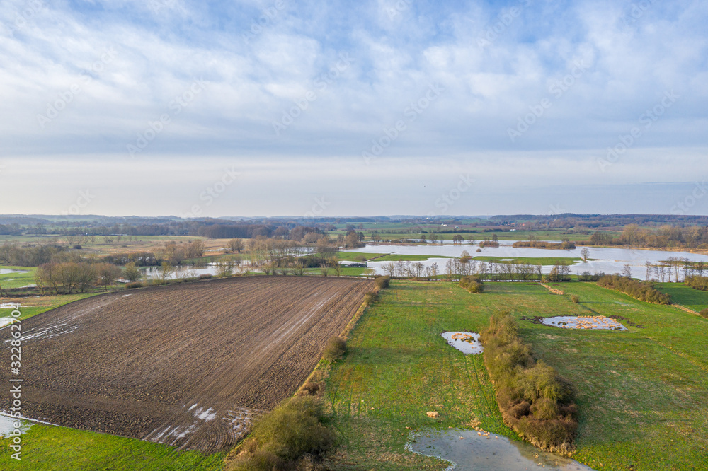a drone flight over meadows and fields, which were flooded after heavy rain