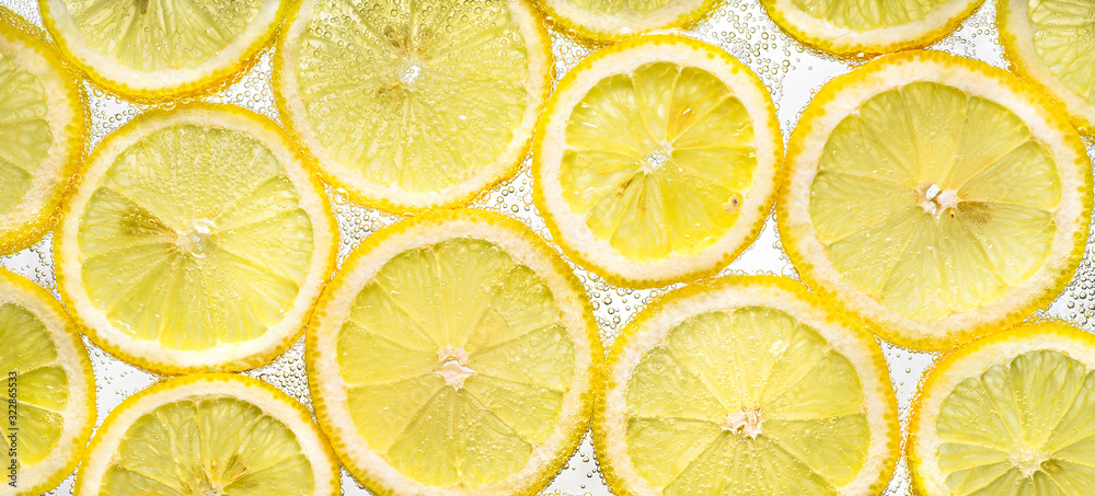 Slices of lemon in water with air bubbles Slices of lemon in water with air bubbles