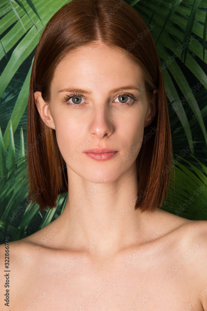 Portrait of young woman with natural red hair, close up. Beautiful fashion model Portrait of young woman with natural red hair, close up. Beautiful fashion model