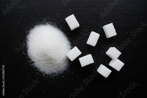 refined sugar cubes on a black background