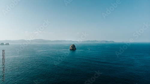 single rock alone sea 