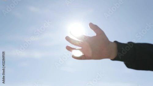 Footage of an adult lending a helping hand to a young child