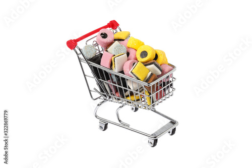 Shopping cart filled with assorted English liquorice candy photo