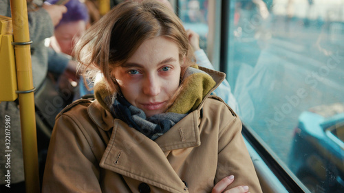 Sick young woman coughs sneezes on the tram cold autumn day flu season disease fever grippe health illness infection influenza migraine sickness slow motion