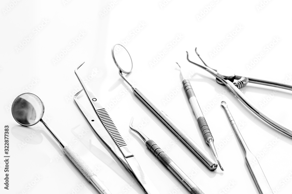 Dental instruments - set with mirrors - on white background close up copy space Dental instruments - set with mirrors - on white background close up copy space
