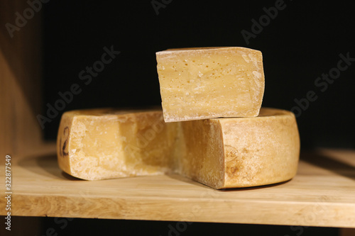 Big piece of cheese on wooden board