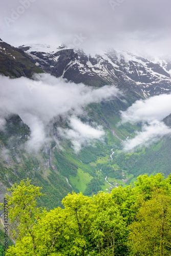 The Swiss Alps at Murren  Switzerland. Jungfrau Region. Tops of the mountains in fog and clouds.