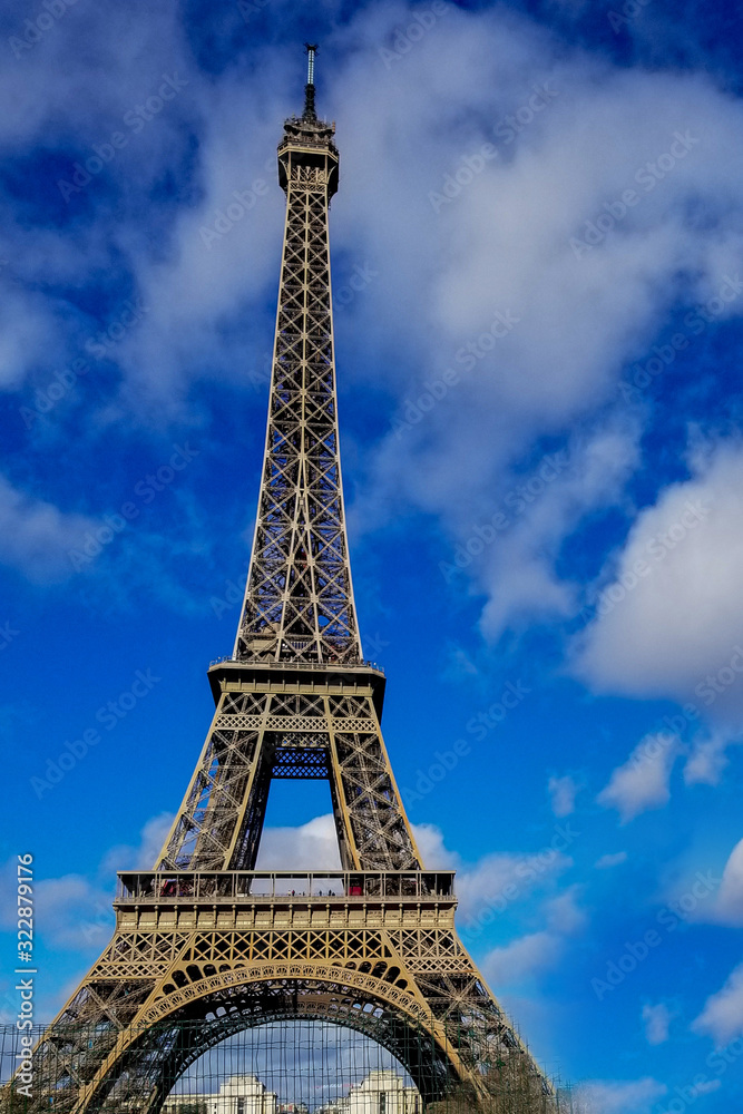 Beautiful photo of the Eiffel tower in Paris with gorgeous colors and wide angle central perspective