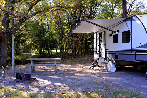 Travel trailer camping in the woods