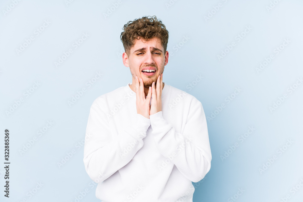 Young blond curly hair caucasian man isolated whining and crying disconsolately. Young blond curly hair caucasian man isolated whining and crying disconsolately.