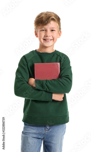 Little boy with book on whi...