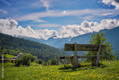 Schilderij op canvas a bench on a mountain in the village of Castiel in Switzerland