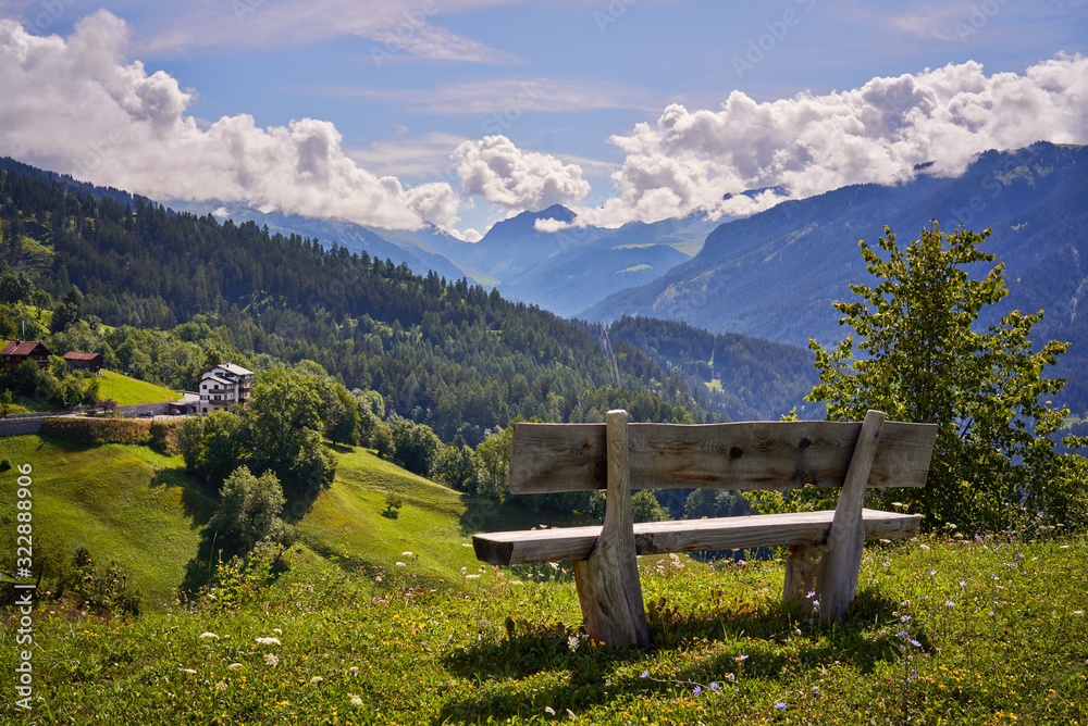 a bench on a mountain in the village of Castiel in Switzerland