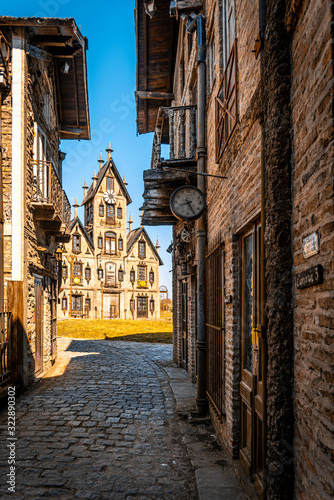 GONZALEZ CATAN, ARGENTINA, SEPTEMBER 28, 2019: cobblestone path through abandoned buildings in the amazing medieval town of Campanopolis. photo