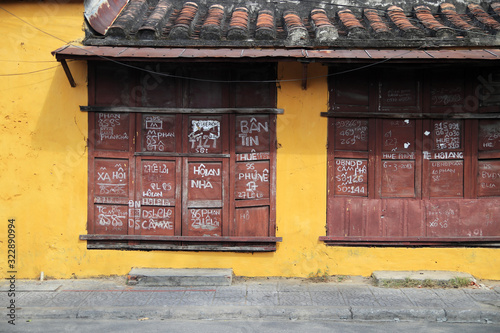Yellow wall with windows view from Hoi An Vietnam