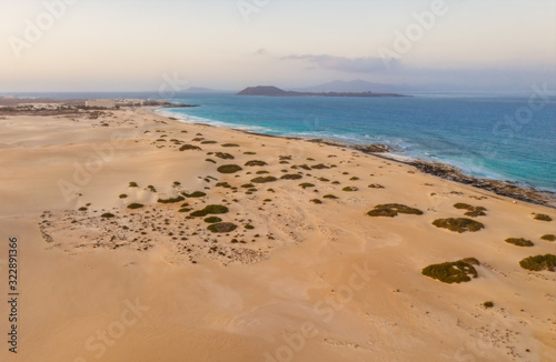 High angle view of road going through Corralejo dunes nature park in Fuerteventura. Aerial drone shot in october 2019