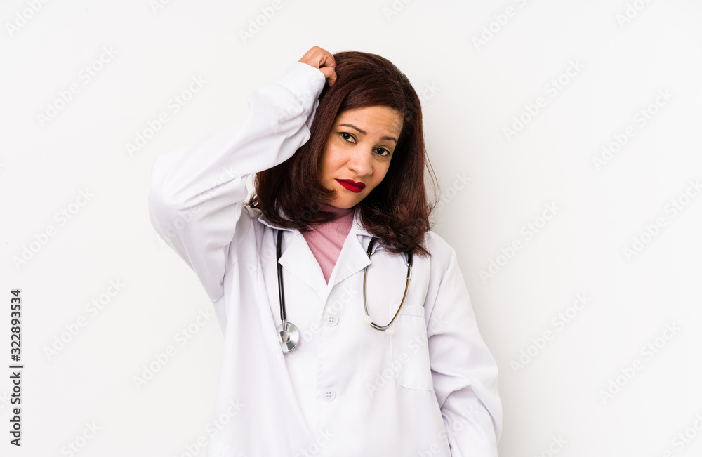 Middle age latin doctor woman isolated being shocked, she has remembered important meeting. Middle age latin doctor woman isolated being shocked, she has remembered important meeting.