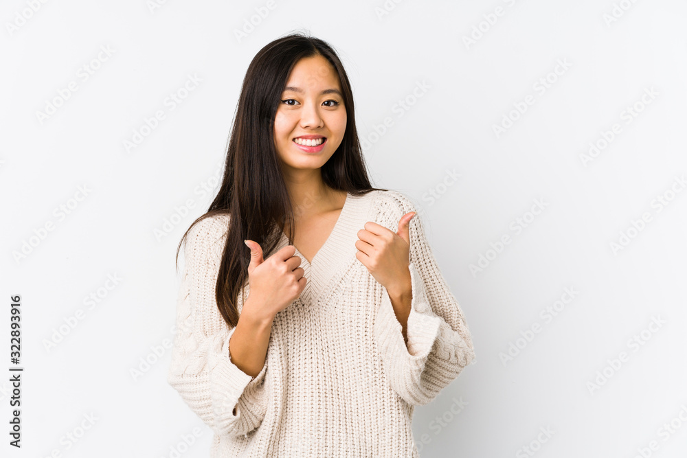 Young chinese woman isolated raising both thumbs up, smiling and confident. Young chinese woman isolated raising both thumbs up, smiling and confident.