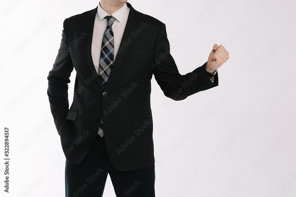 portrait of a businessman standing on a white background with fists portrait of a businessman standing on a white background with fists
