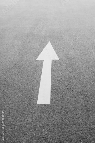 Arrow sign. Keep going straight.