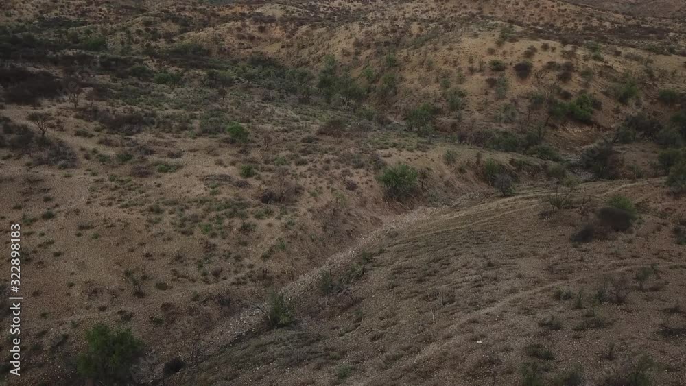 4K aerial drone summer day video African savanna and dry riverbeds surrounded by bush covered hills in Daan Viljoen National Game Park in Khomas Hochland area near Windhoek, Namibia's capital, Africa 4K aerial drone summer day video African savanna and dry riverbeds surrounded by bush covered hills in Daan Viljoen National Game Park in Khomas Hochland area near Windhoek, Namibia's capital, Africa