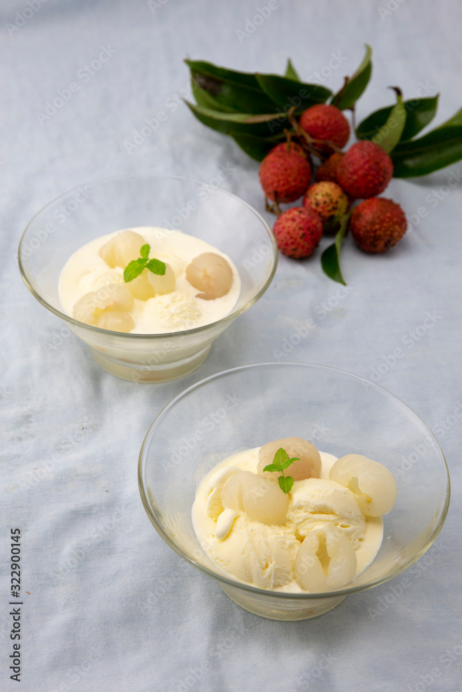 Garnished lychee and vanilla ice cream with lychee leaf