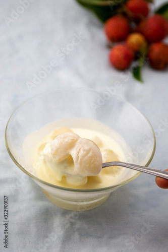 Garnished lychee and vanilla ice cream with lychee leaf