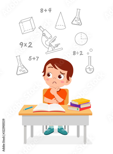 happy cute little kid boy thinking on exam