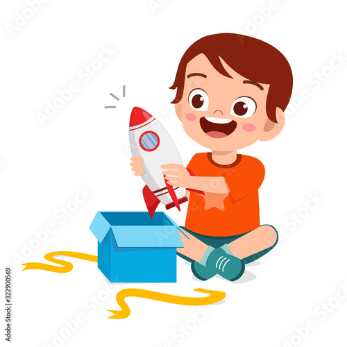 happy cute little kid boy open gift from birthday