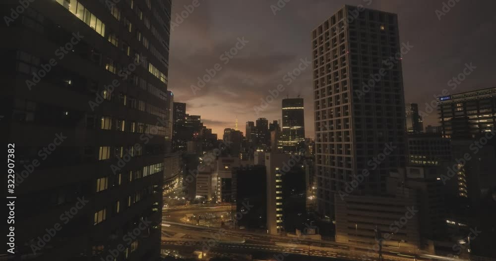 Timelapse of sunrise in Tokyo, Japan. Tokyo Tower between the buildings. Timelapse of sunrise in Tokyo, Japan. Tokyo Tower between the buildings.