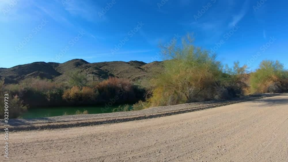 POV driving on dirt road along Gila Irrigation Canal - Yuma Arizona POV driving on dirt road along Gila Irrigation Canal - Yuma Arizona