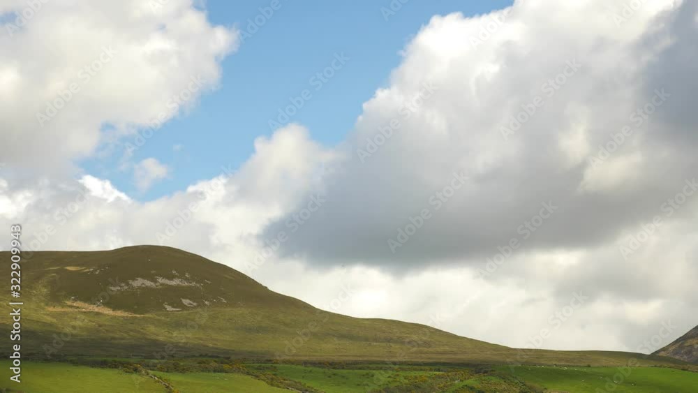 Gorgeous time lapse of clouds over grassy Irish hills. Gorgeous time lapse of clouds over grassy Irish hills.