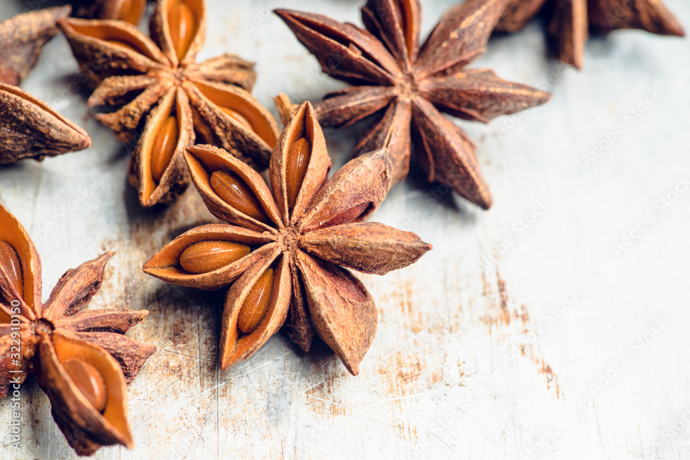 Dried anise stars on the rustic background. Selective focus. Shallow depth of field.