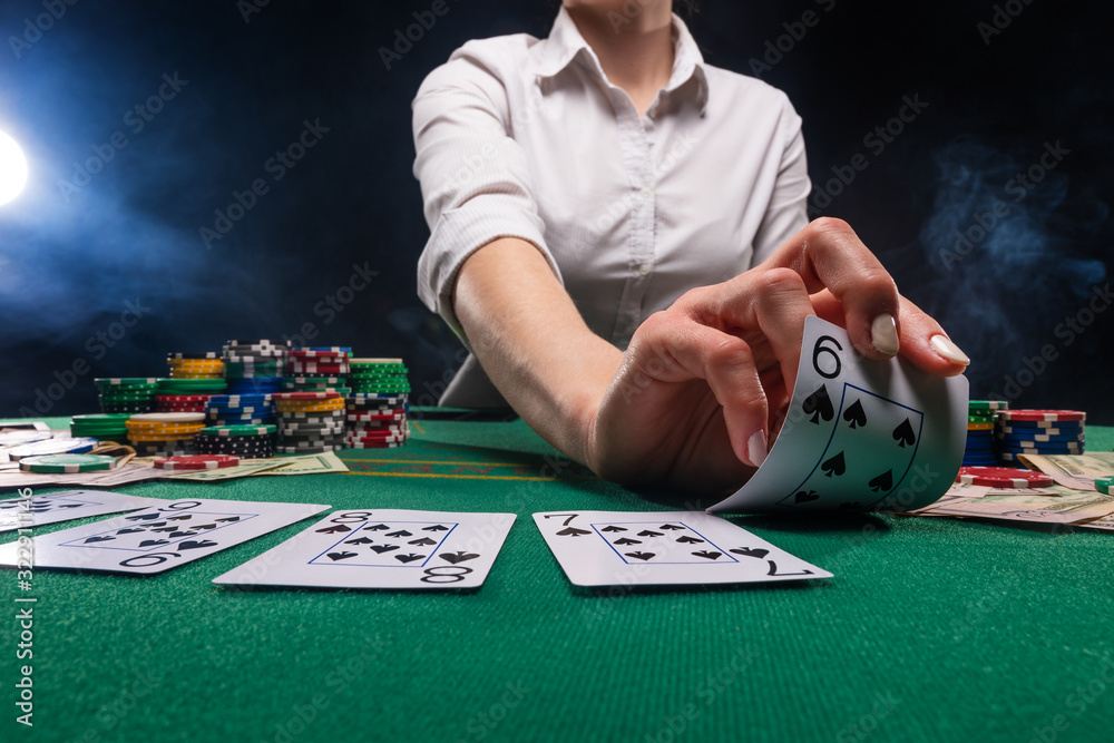 The croupier at the gaming table in the casino. The croupier at the gaming table in the casino.