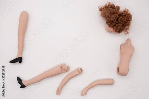 Broken Doll Body Parts on white Background