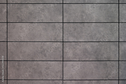Wall texture and gray block pattern are suitable for a simple design background.