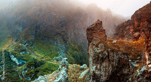 Picturesque multi-colored mountain landscape in fog Elbrus region, wallpaper postcard. Outdoor adventure concept