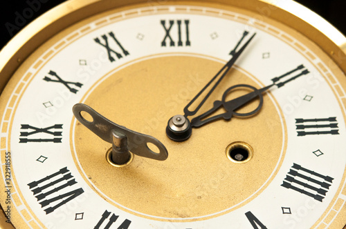 golden and white clock in front