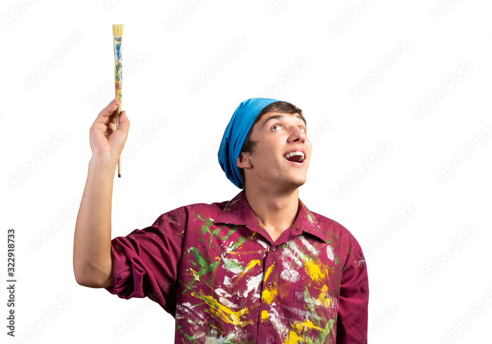 Smiling young painter artist holding paintbrush Smiling young painter artist holding paintbrush