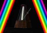 Metronome isolated on black background with rainbow stripes