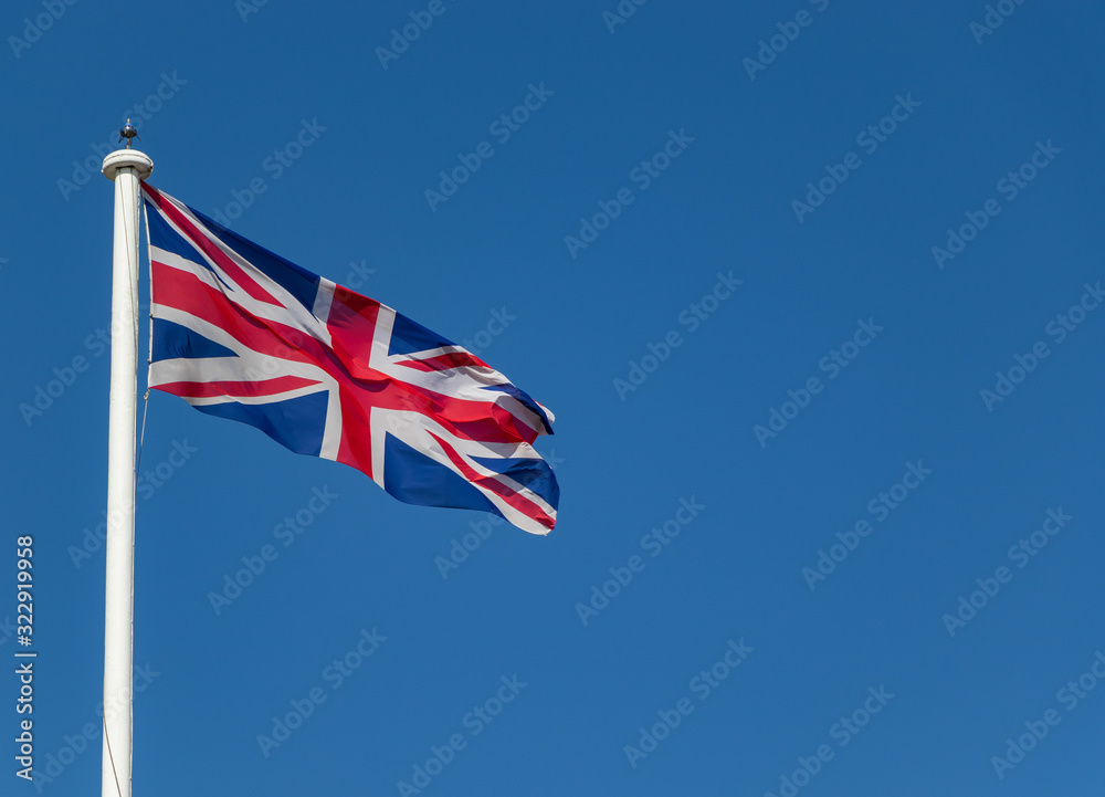 Great Britain flag on top of the Tower of London on a sunny day, London, UK