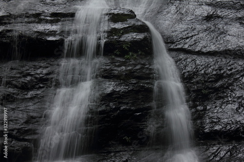 Silky water long exposure detail of waterfall Cueva del Guacharo National Park Caripe Monagas Venezuela