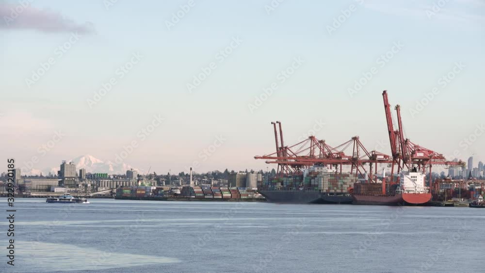 Burrard Inlet Cargo British Columbia 4K UHD. The view looking down over Burrard Inlet and downtown Vancouver. 4K. UHD. Burrard Inlet Cargo British Columbia 4K UHD. The view looking down over Burrard Inlet and downtown Vancouver. 4K. UHD.