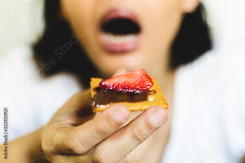 woman eating bitscuit. 
