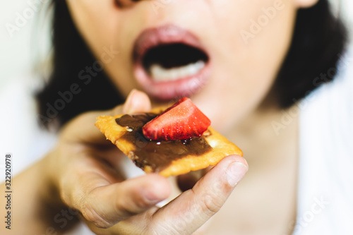 woman eating bitscuit. 