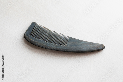 Closeup of a handmade comb made from water buffalo horn bought from a street market in Guilin, Guangxi, China. Natural, sustainable, enviromental.