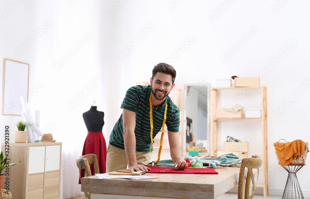 Fashion designer creating new clothes in studio Fashion designer creating new clothes in studio