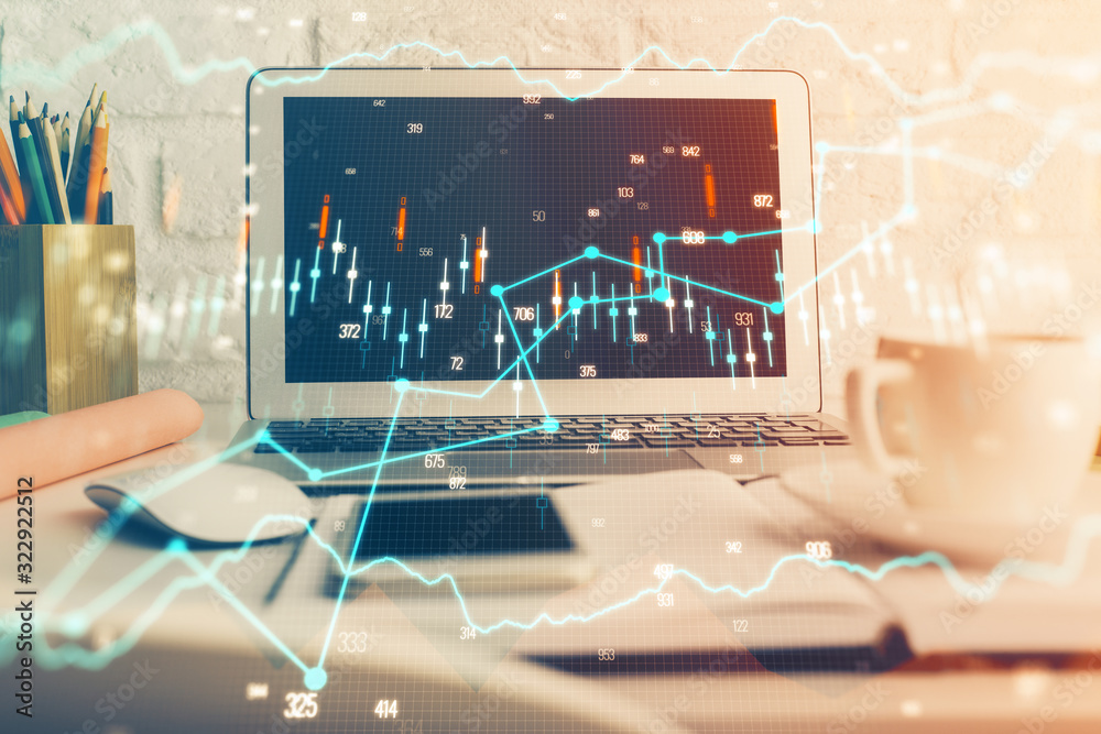 Financial market graph hologram and personal computer on background. Double exposure. Concept of forex. Financial market graph hologram and personal computer on background. Double exposure. Concept of forex.