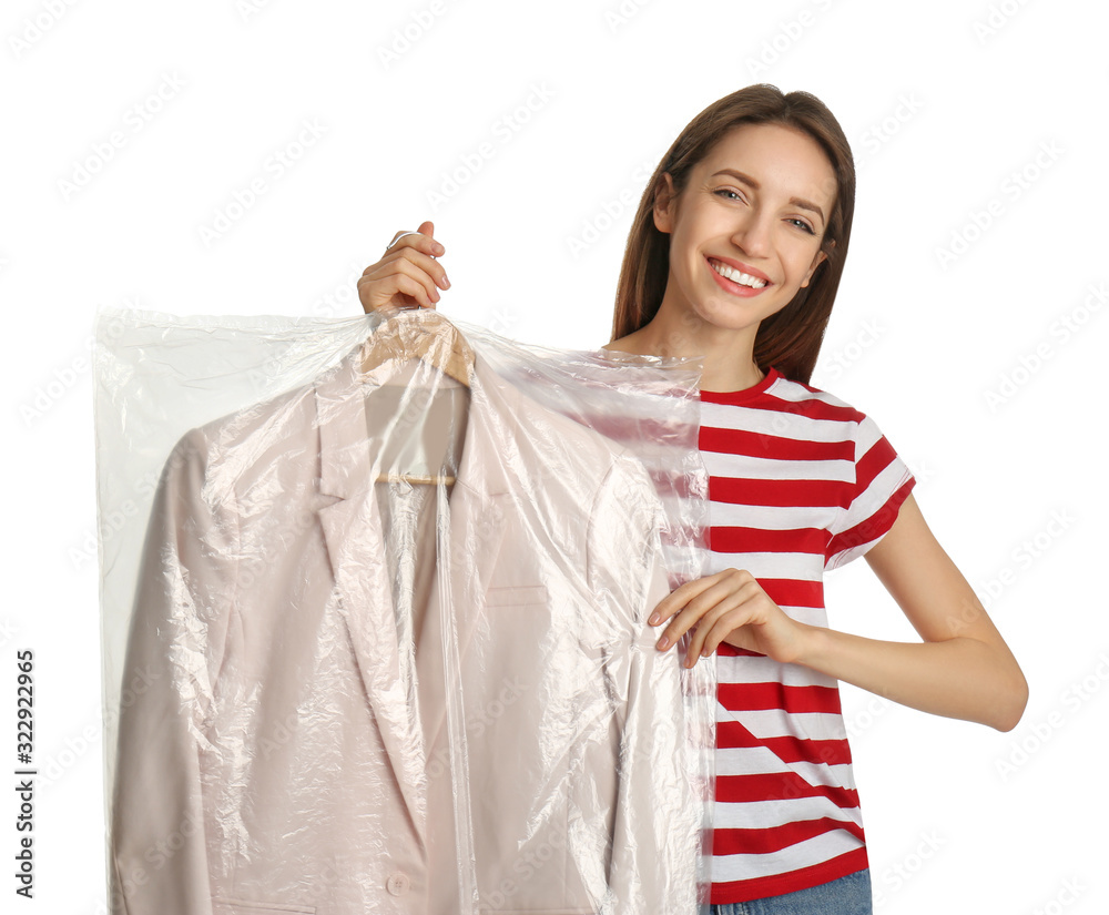 Young woman holding hanger with jacket in plastic bag on white background. Dry-cleaning service Young woman holding hanger with jacket in plastic bag on white background. Dry-cleaning service
