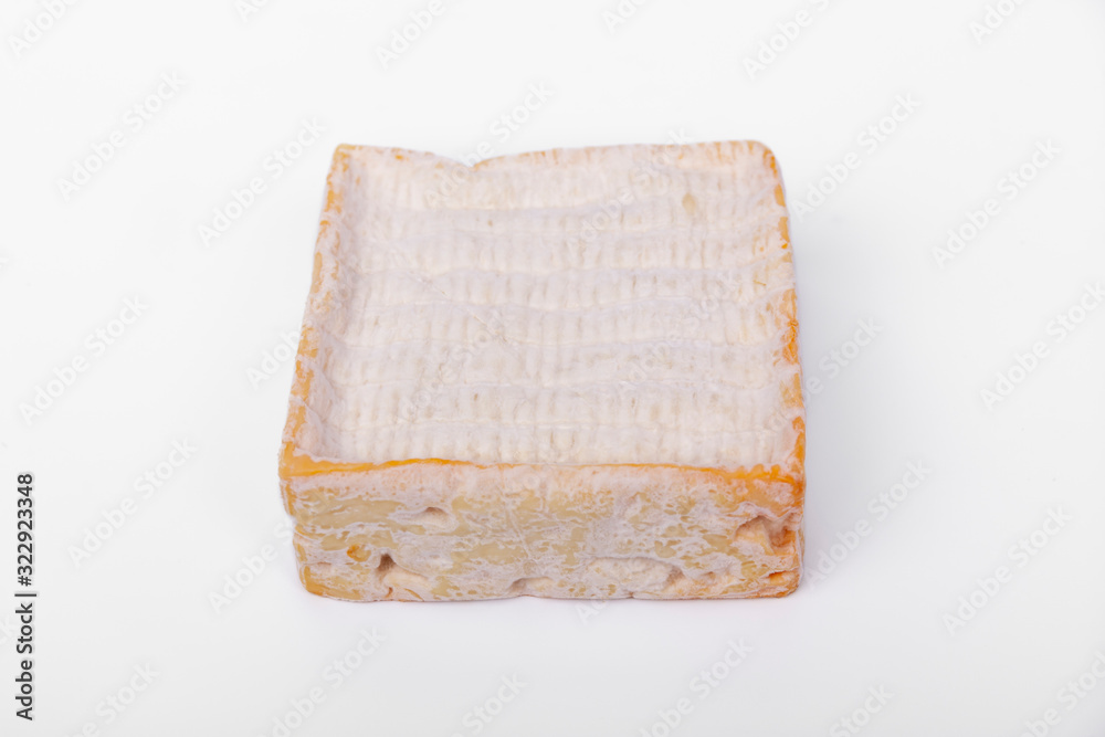 french cow's milk cheese called Pont-l'Évêque isolated on white background